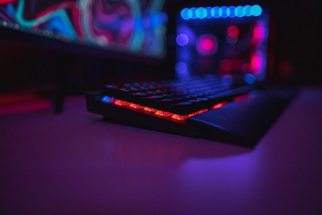 Picture of a keyboard lit up with red rgb lights.